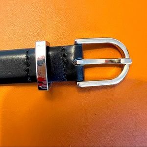 - Auxiliary thin leather black belt with silver hardware $35